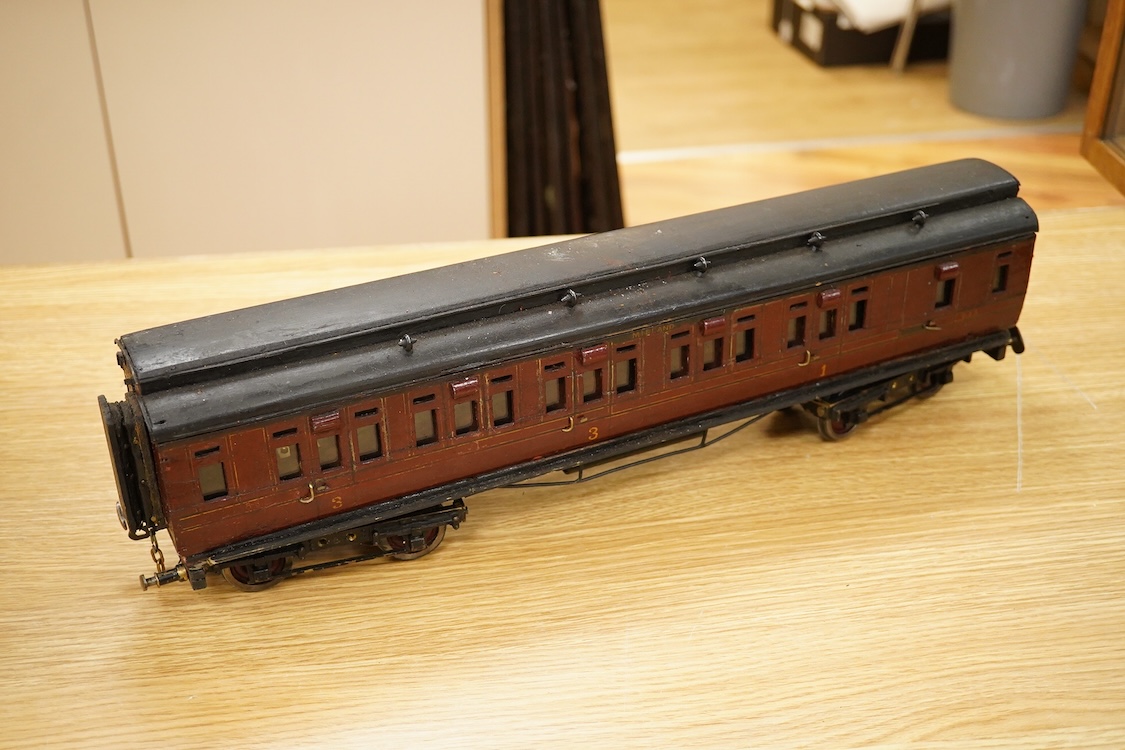 Two Gauge One bogie coaches; a Midland Railway clerestory coach, together with a 12-wheel Pullman car (bogies af), plus an American outline caboose, some scratch building and adaptation from kits, etc.